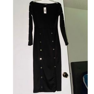 Black long sleeve, mid length dress. NEVER USED